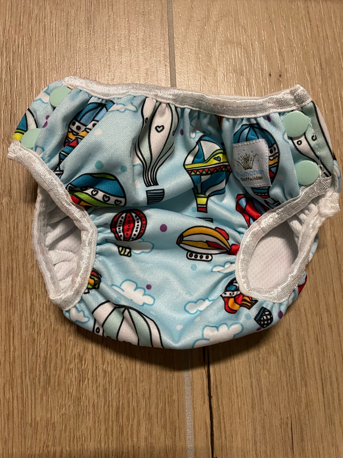 Schwimmwindeln von Blümchen und Popolini