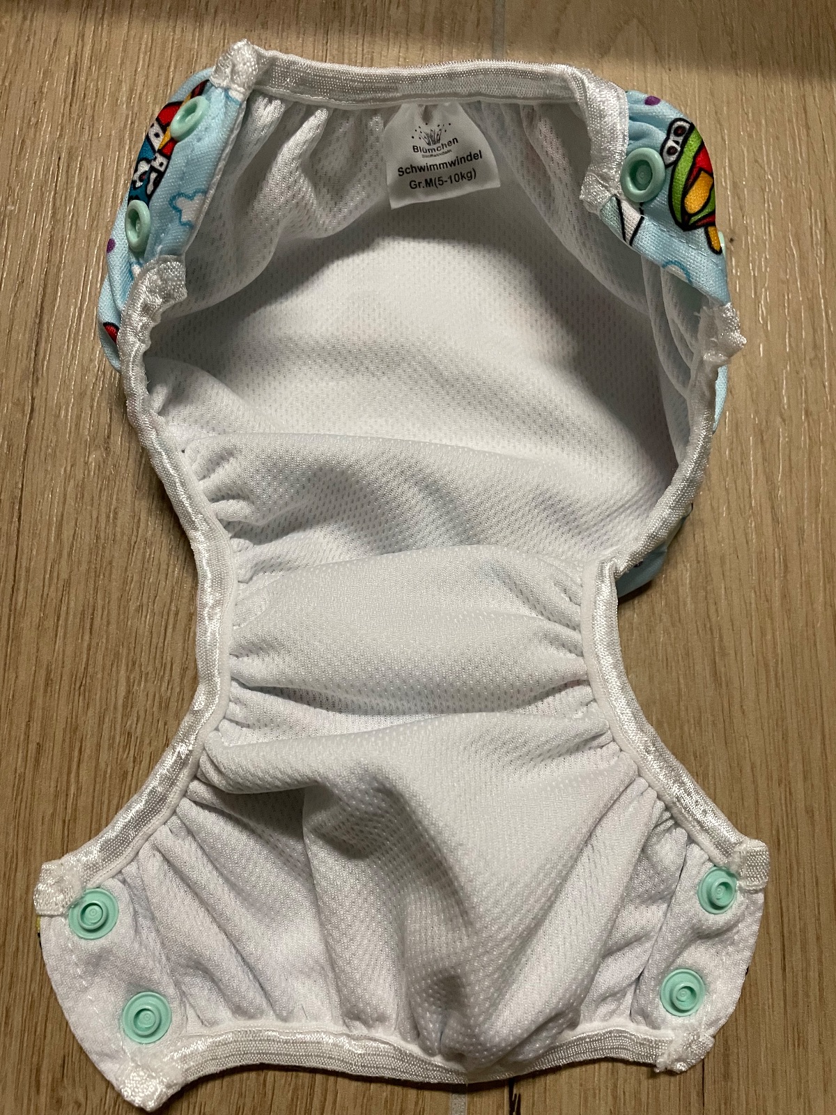 Schwimmwindeln von Blümchen und Popolini