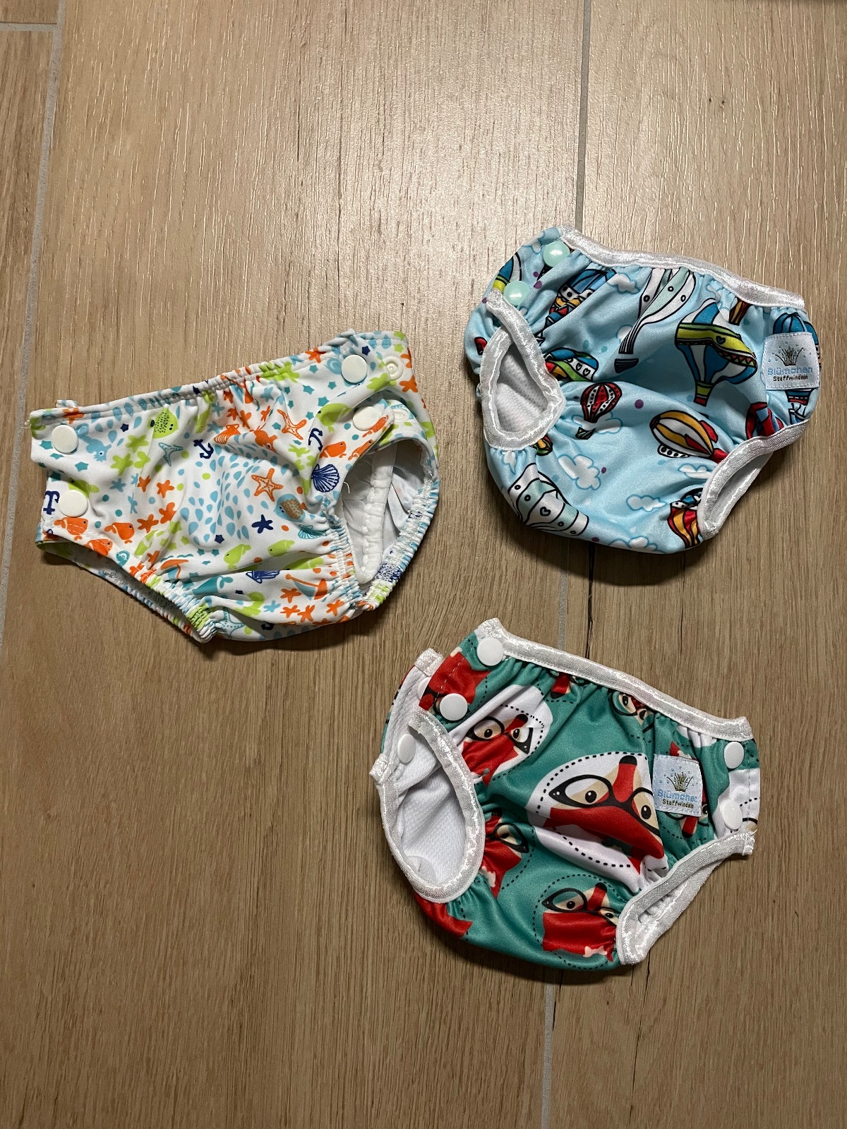 Schwimmwindeln von Blümchen und Popolini